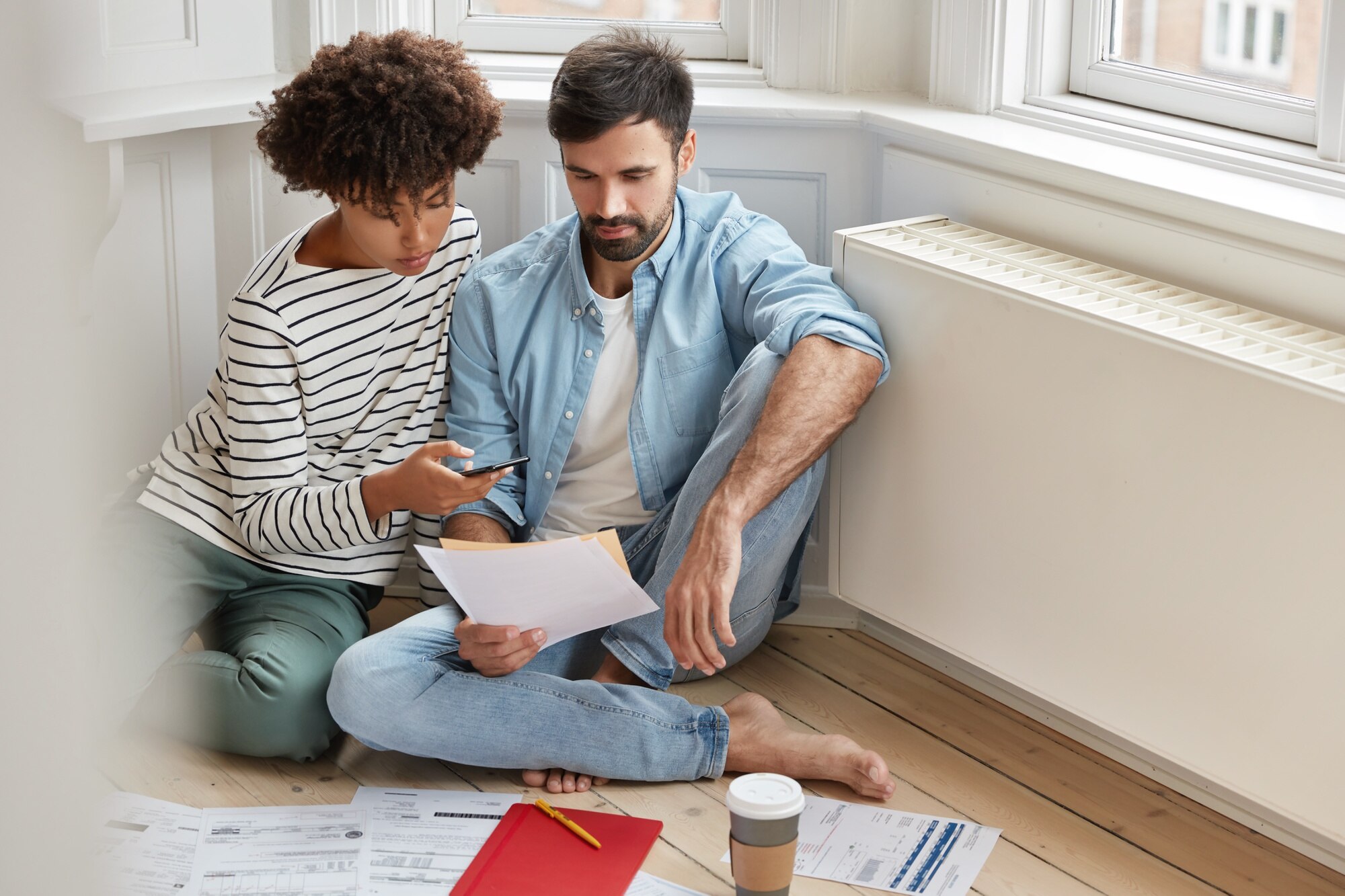 How To Sell A House With Fire Damage care multiethnic woman and man examine paperwork