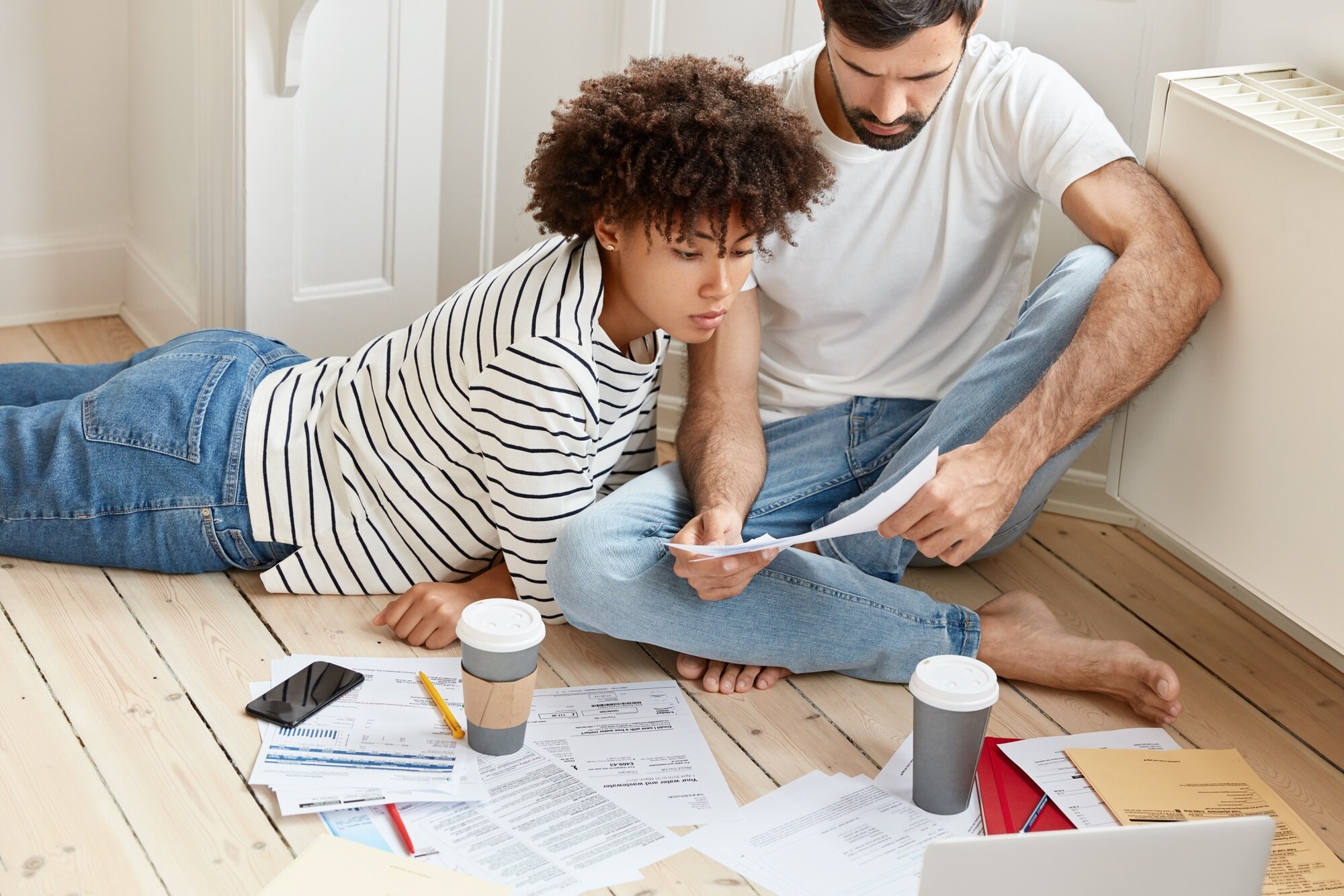 Avoid Capital Gains Tax on Inherited Property family couple maintains home accounting discuss plans and future payments