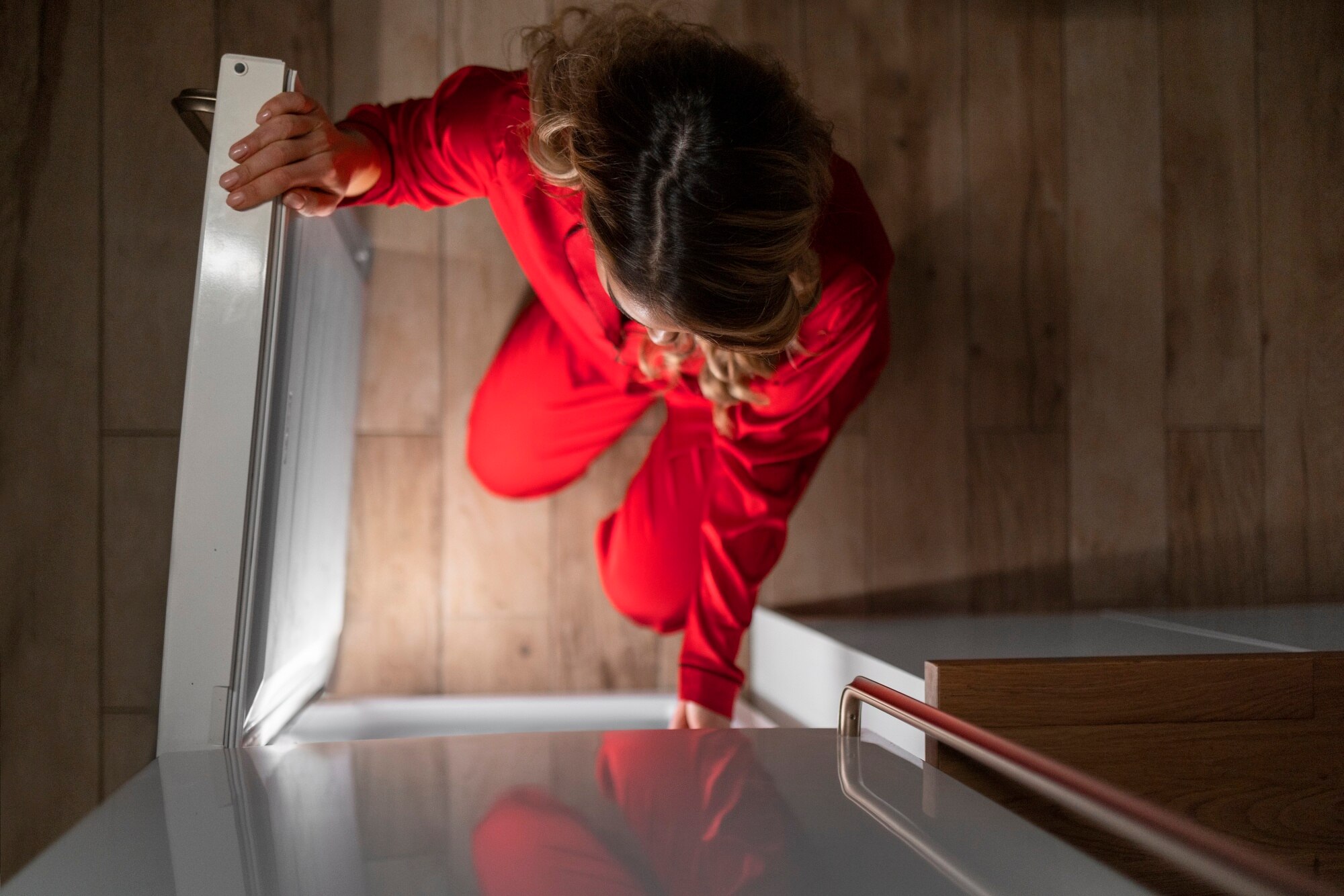 How To Sell A House With Fire Damage full shot woman checking fridge at night