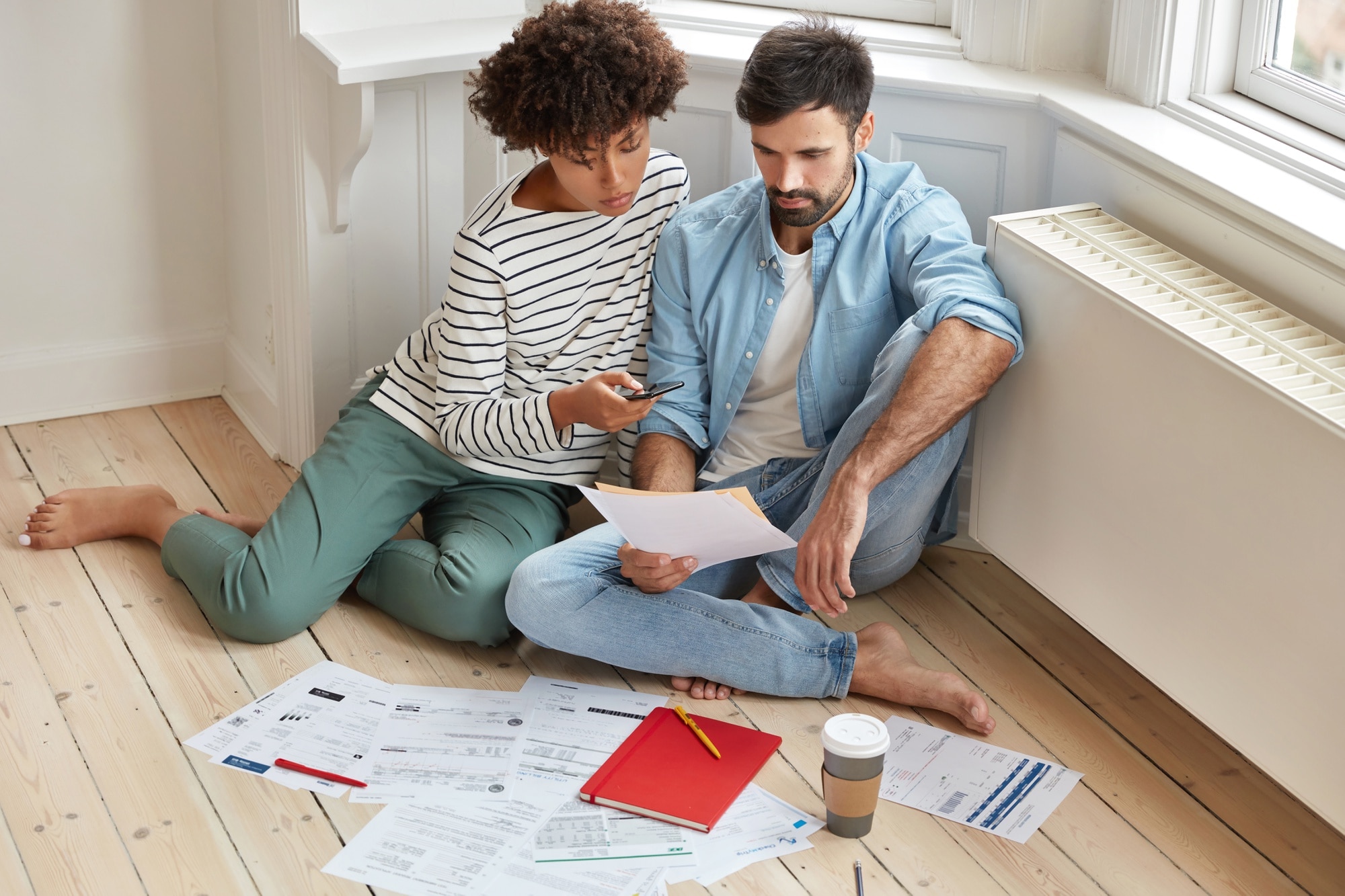 Cash Home Buyers in Los Angeles: A Comprehensive Guide indoor shot of mixed race family couple analyze data develop new startup project