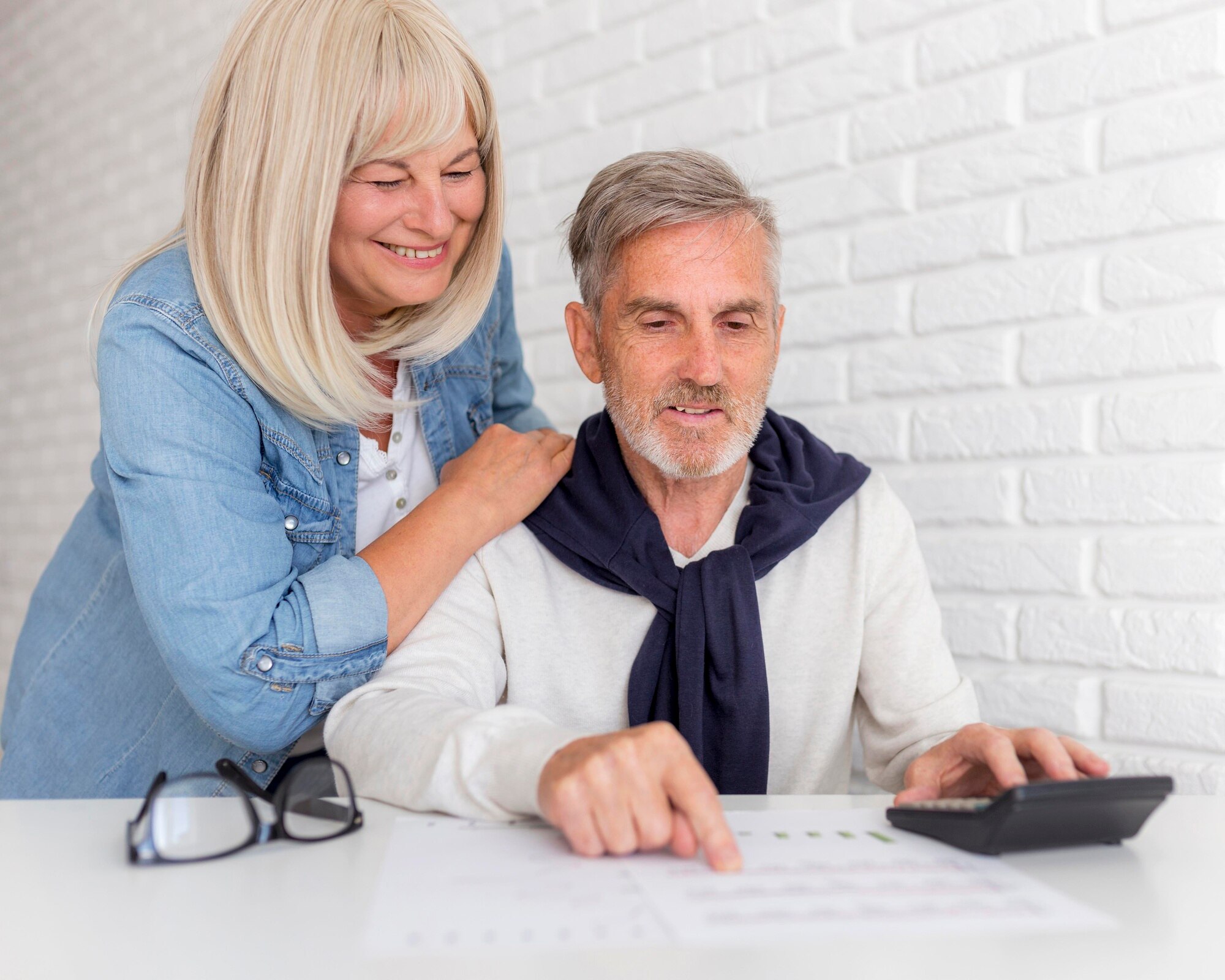 Short Sales and Credit Reports medium shot couple looking at document
